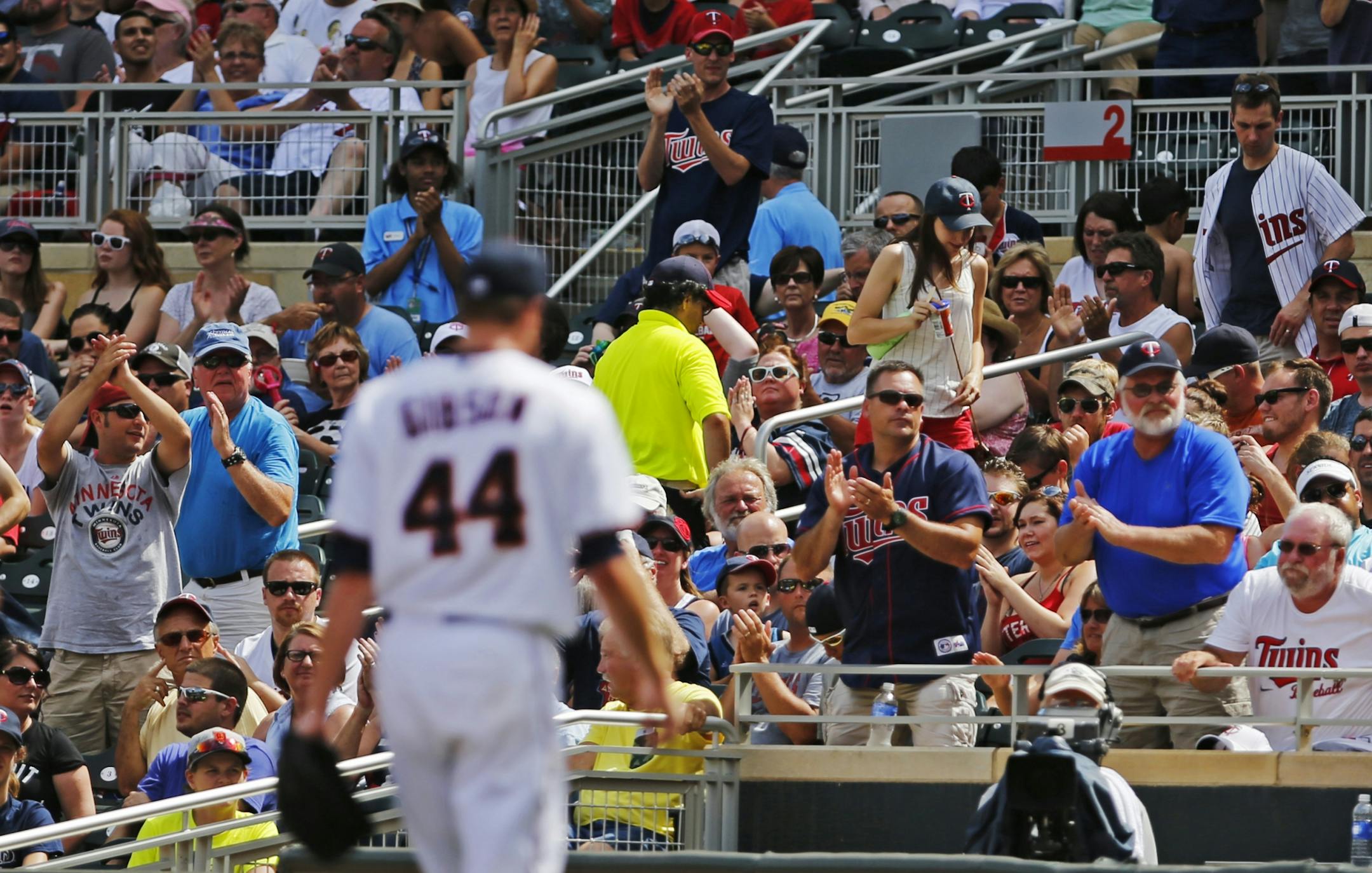 At Target Field in a game between the Twins and the Tigers on July 12, 2015, starting pitcher Kyle Gibson went to the dugout after the seventh inning to applause from the fans.