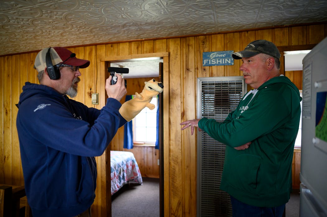Erik Osberg, Otter Tail County’s Rural Rebound Initiative Coordinator, filmed a promotional video with his “Inner Otter” hand puppet alongside resort co-owner Jim Wherley at Sunset Bay Resort in Richville, Minn.