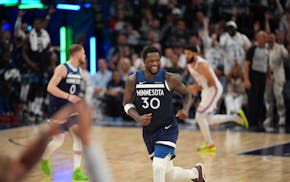 Wolves forward Julius Randle (30) celebrates a three-pointer in the fourth quarter.