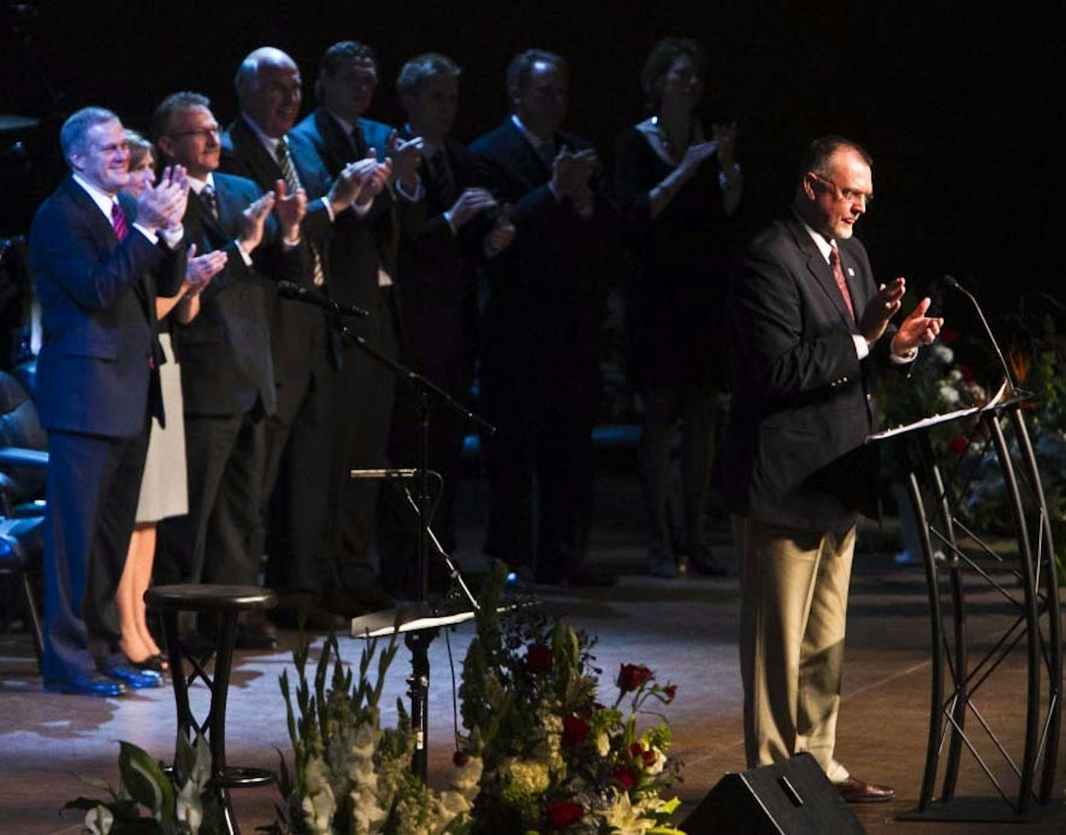 Minnesota Twins Hall of Famer Bert Blyleven, right, applauds as he asks mourners to imagine that former Twins' baseball player Harmon Killebrew just hit his 574th home run during the funeral service for her Killebrew at the Christ Church of the Valley in Peoria, Ariz., Friday, May 20, 2011. The Hall of Fame slugger died Tuesday, May 17, of esophageal cancer at 74.