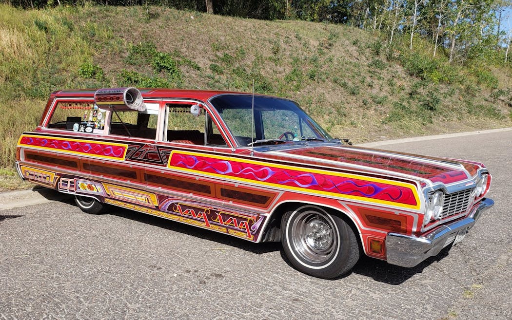 John Tretten of Edina custom painted his 1964 Chevy wagon after being inspired by car customizers of the 1960s. He brought it to the car meet at Buck Hill ski resort in Burnsville on Sept. 13 because he thought the late summer twilight would make the colors pop.