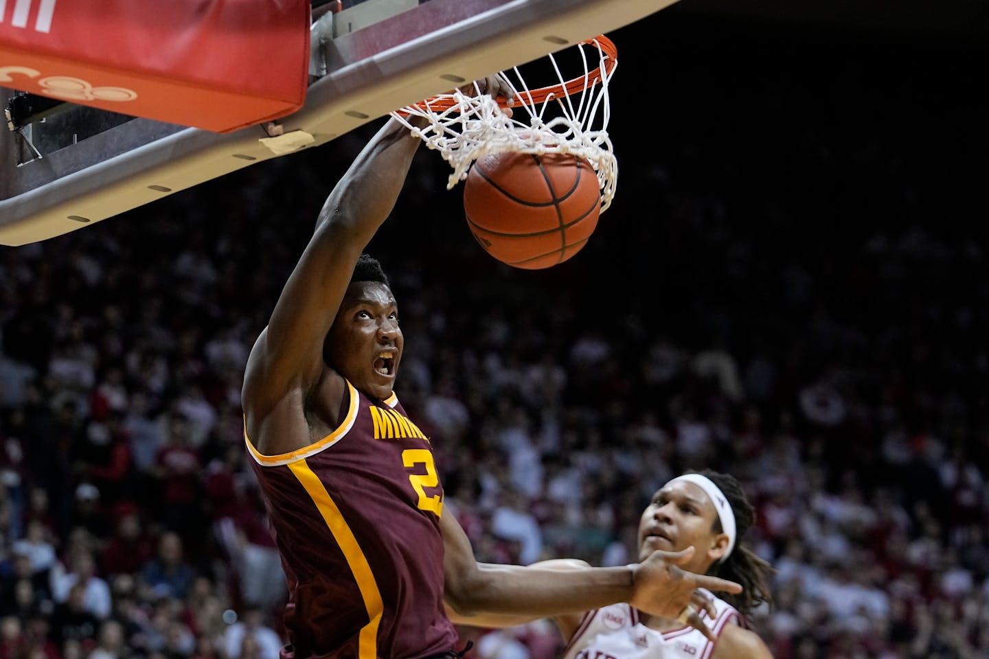 Minnesota forward Pharrel Payne (21) dunks during the first half of an NCAA college basketball game against Indiana, Friday, Jan. 12, 2024, in Bloomington, Ind. (AP Photo/Darron Cummings)