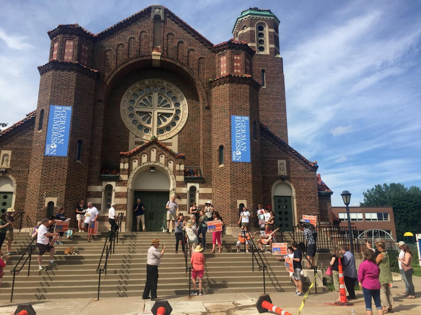 Supporters hold a tribute to the former St. Andrew's Church in St. Paul on Sunday, July 21, 2019.