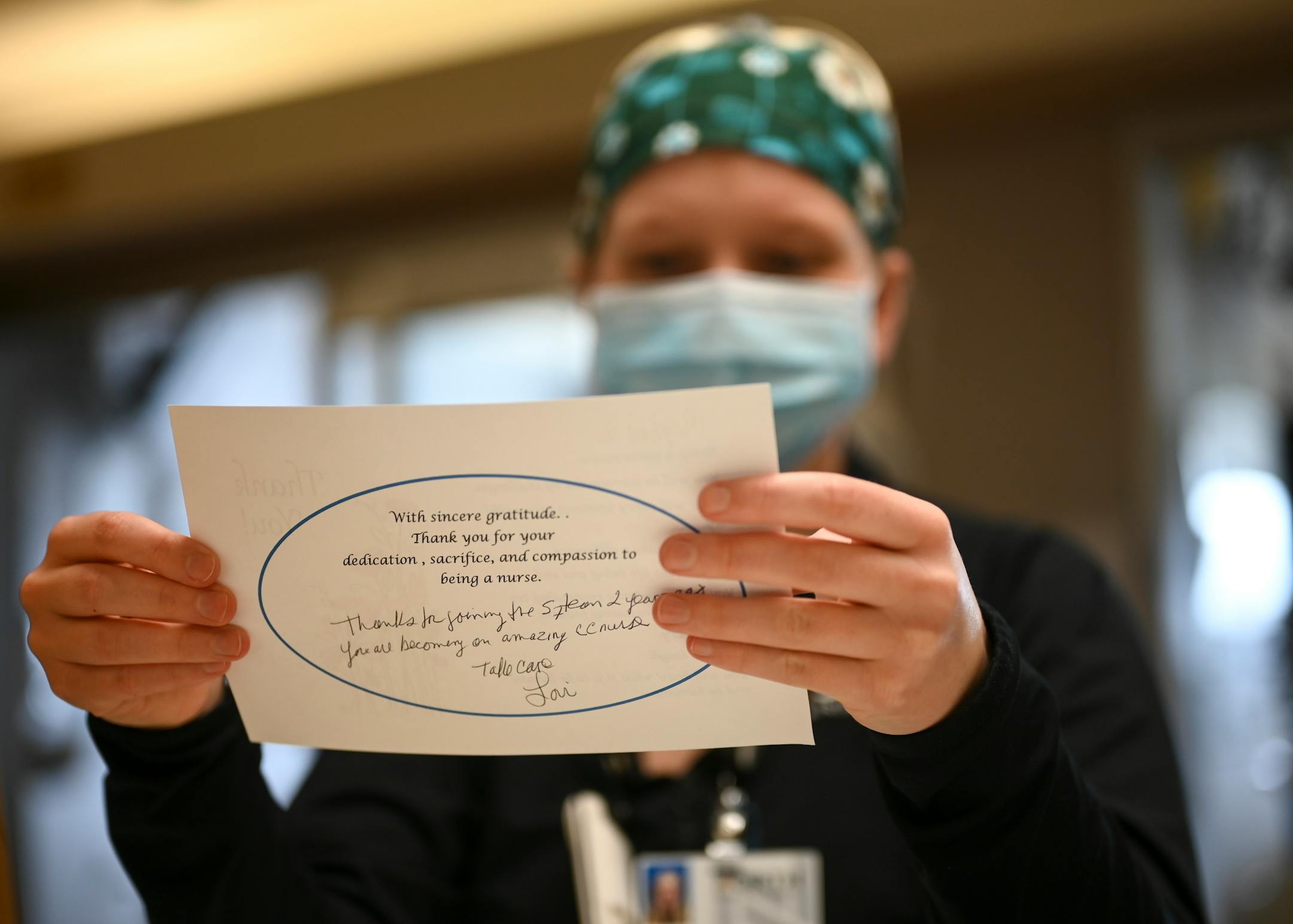 North Memorial critical care nurse Meghan Lund read a thank-you note written by nurse manager Lori Wildman Wednesday as the South 7 ICU commemorated a year of COVID-19 within its walls.