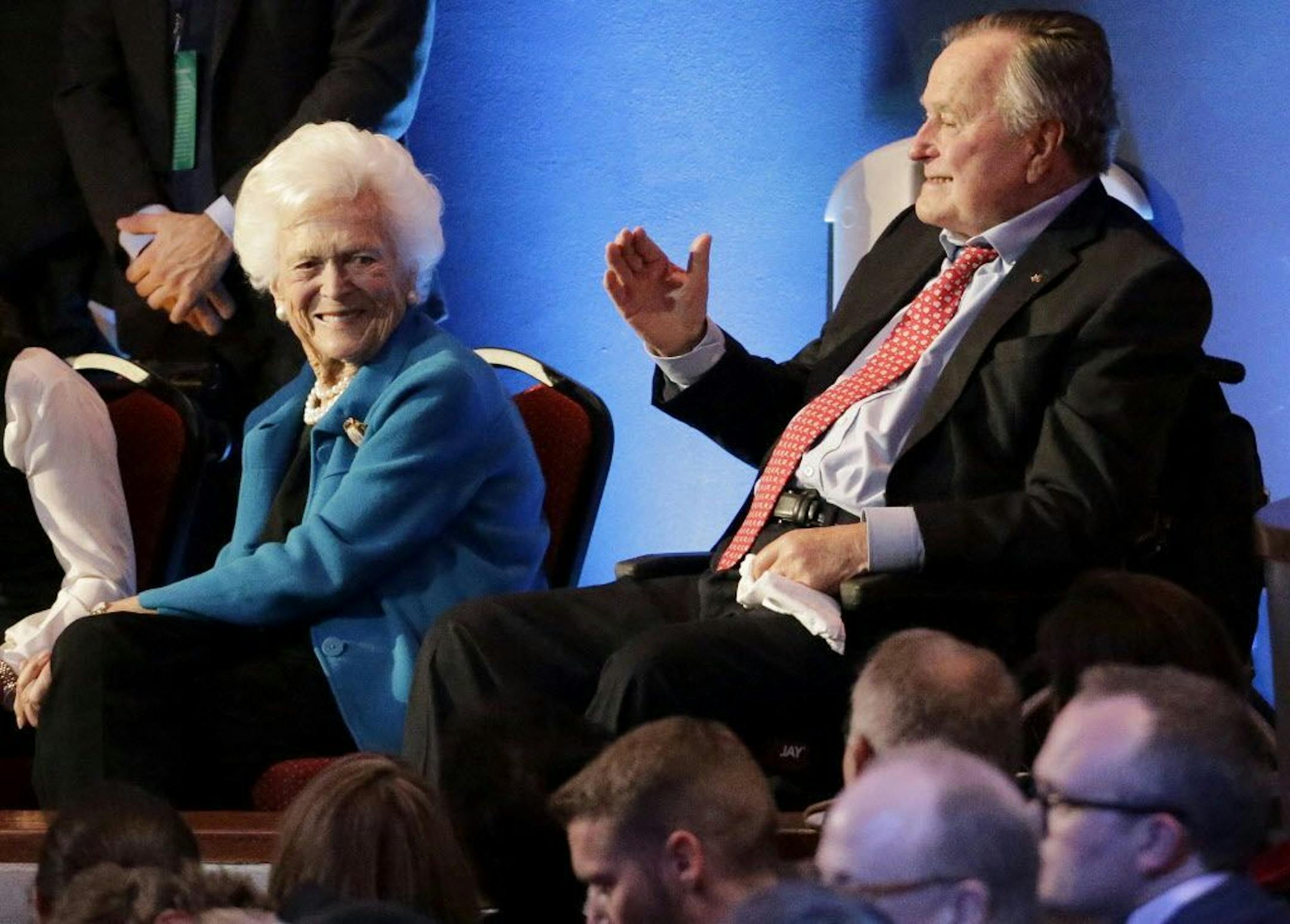 FILE - In this Thursday, Feb. 25, 2016 file photo, former President George H. W. Bush, right, and his wife, Barbara, are greeted before a Republican presidential primary debate at The University of Houston in Houston.