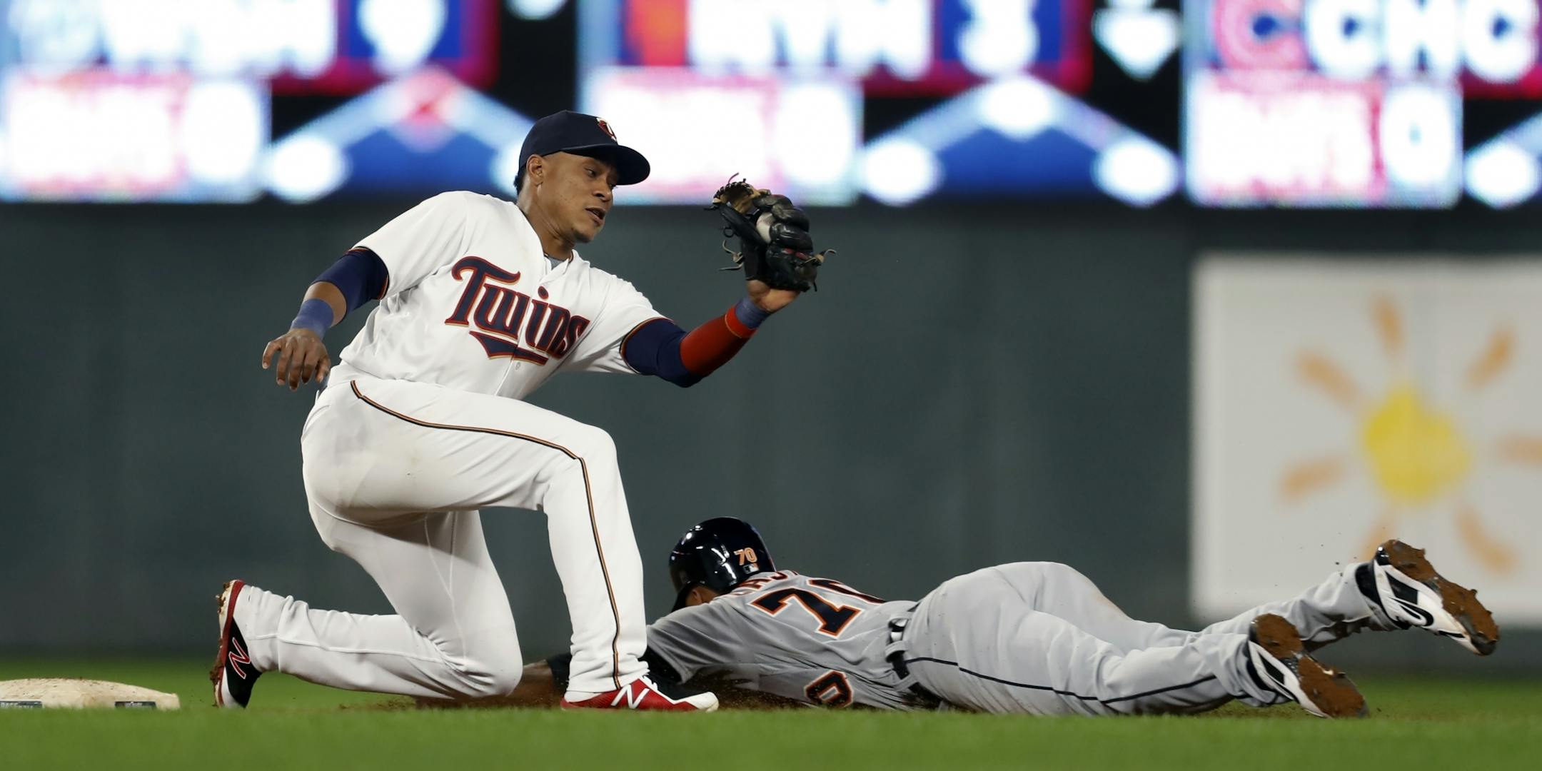 Harold Castro(70) steals second base in the 8th inning as Jorge Polanco(11) is late on the tag.