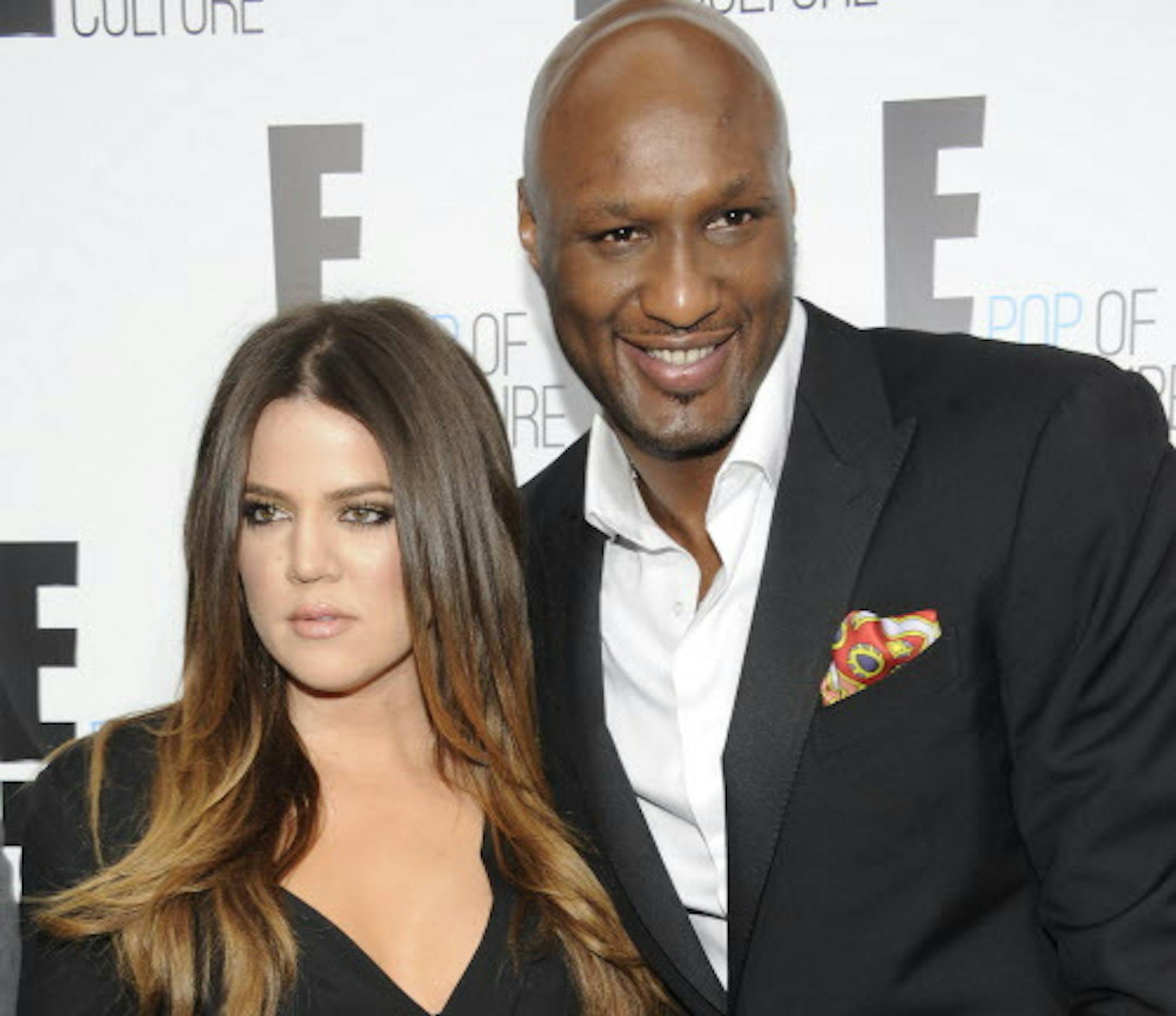 FILE - In this April 30, 2012 file photo, Khloe Kardashian Odom and Lamar Odom from the show "Keeping Up With The Kardashians" attend an E! Network upfront event at Gotham Hall in New York. Odom, the former NBA star and reality TV personality embraced by teammates and fans alike for his humble approach to fame, was hospitalized and his estranged wife Khloe Kardashian is by his side, after being found unresponsive in a Nevada brothel where he had been staying for days. (AP Photo/Evan Agostini, Fi