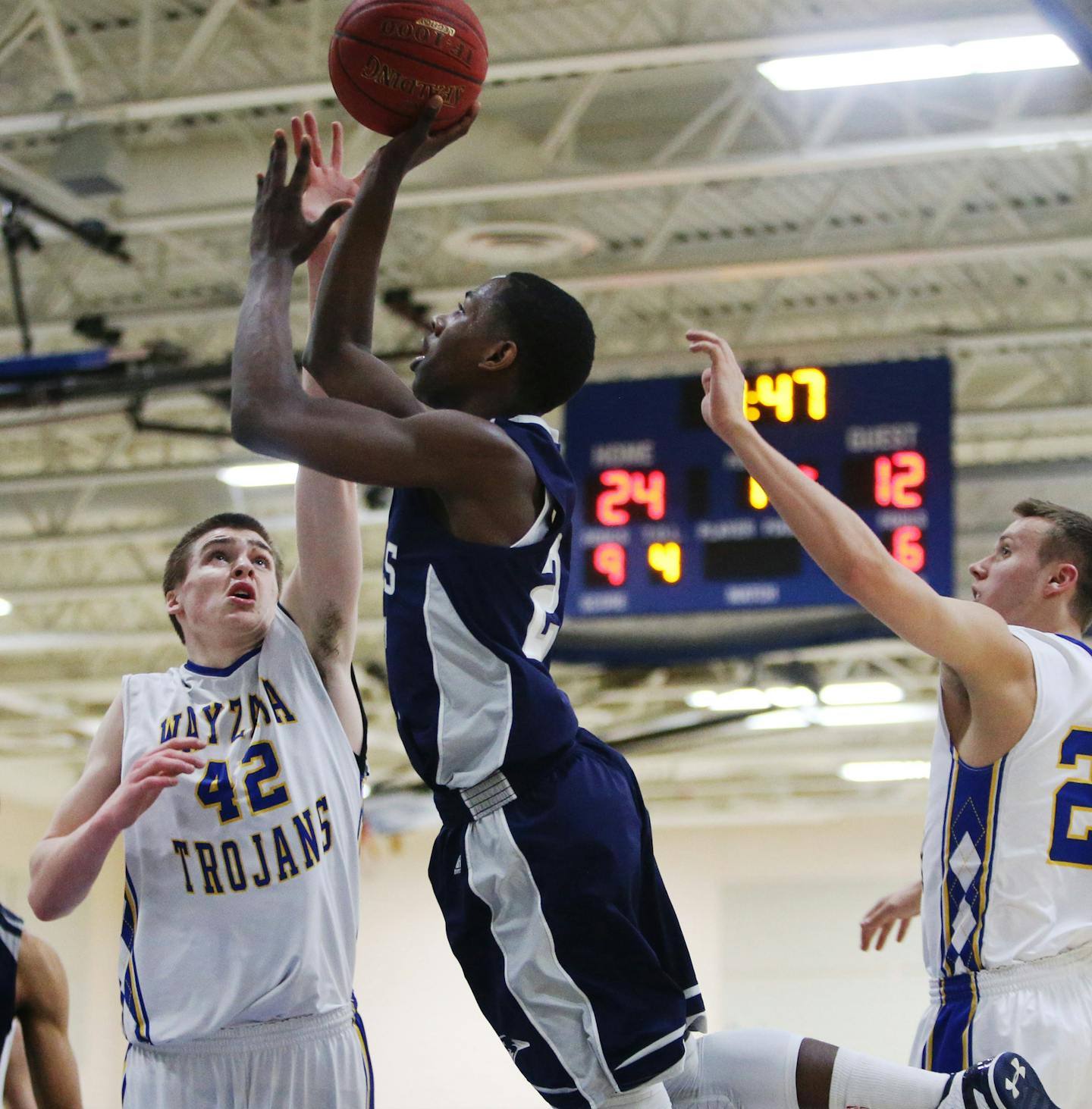 Champlin Park High's McKinley Wright drives to the basket against Wayzata High's Troy Louwagie (42) during the first half of the Class 4A, Section 5 boys' basketball section final at Roger High School Friday, March 6, 2015, in Rogers, MN.](DAVID JOLES/STARTRIBUNE)djoles@startribune.com Class 4A, Section 5 boys' basketball section final at Roger High School Friday, March 6, 2015, in Rogers, MN.