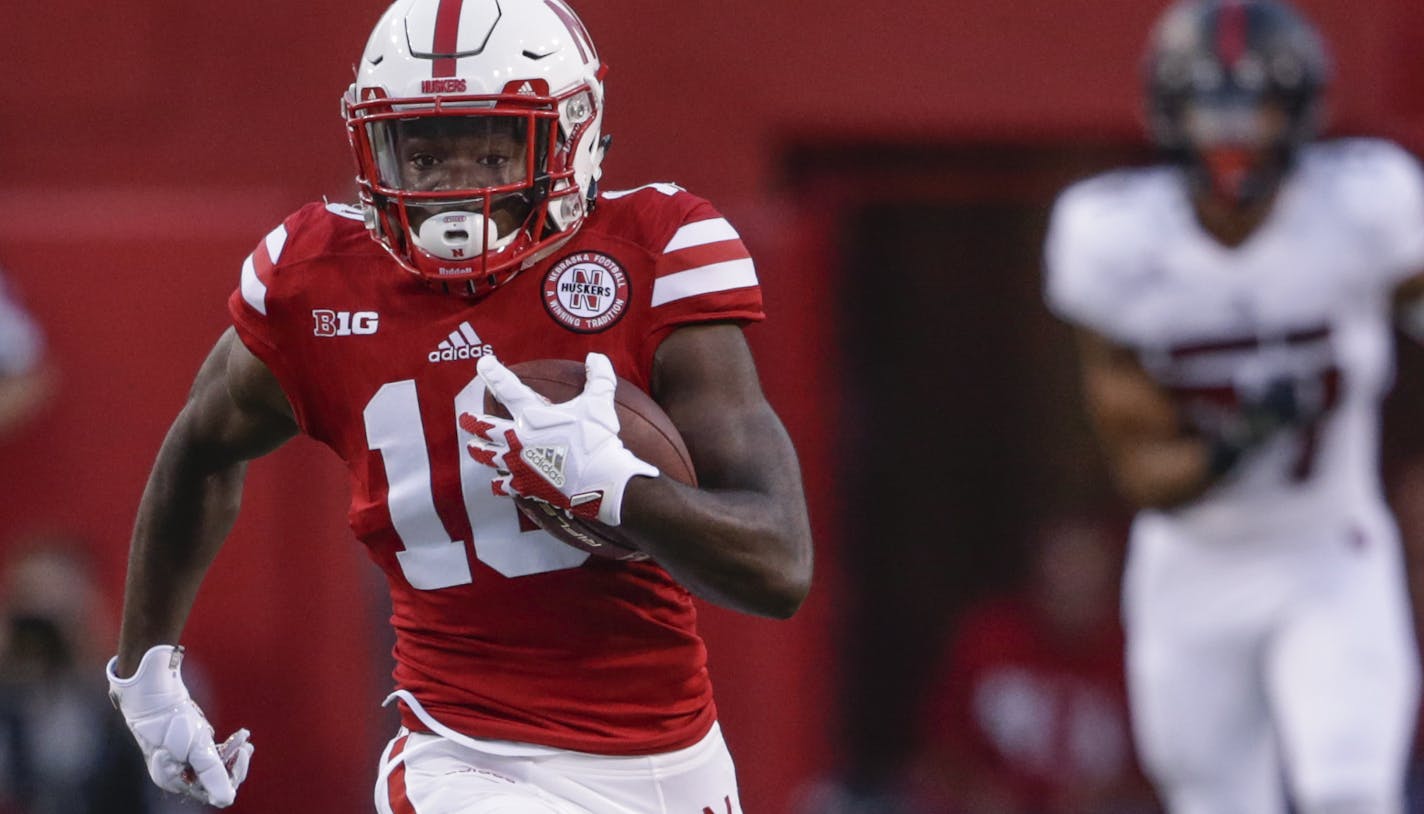 Nebraska wide receiver JD Spielman (10) is chased by Arkansas State defensive back Kyle Martin (12) as he return a punt for a touchdown during the first half of an NCAA college football game in Lincoln, Neb., Saturday, Sept. 2, 2017. (AP Photo/Nati Harnik)