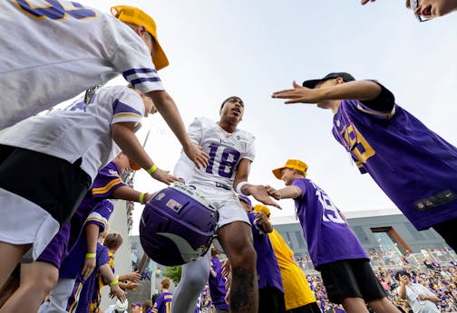 Minnesota Vikings receiver Justin Jefferson (18) runs out for evening practice Tuesday, August 8, 2023, at TCO Stadium in Eagan, Minn.