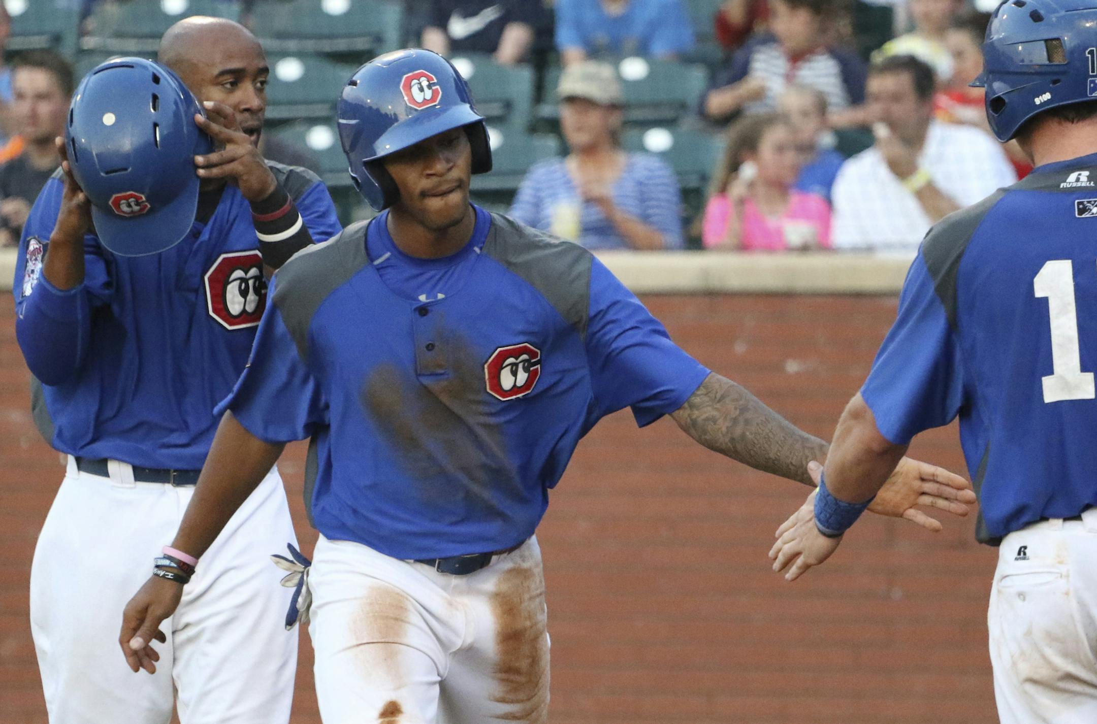 Photo by Dan Henry - Chattanooga Lookouts outfielder Byron Buxton #7, center, receives appreciation from teammate Travis Harrison after scoring against the Biloxi Shuckers at AT&T Field in Chattanooga, Tenn., on Friday, May 29, 2015. ORG XMIT: MIN1506010941420316
