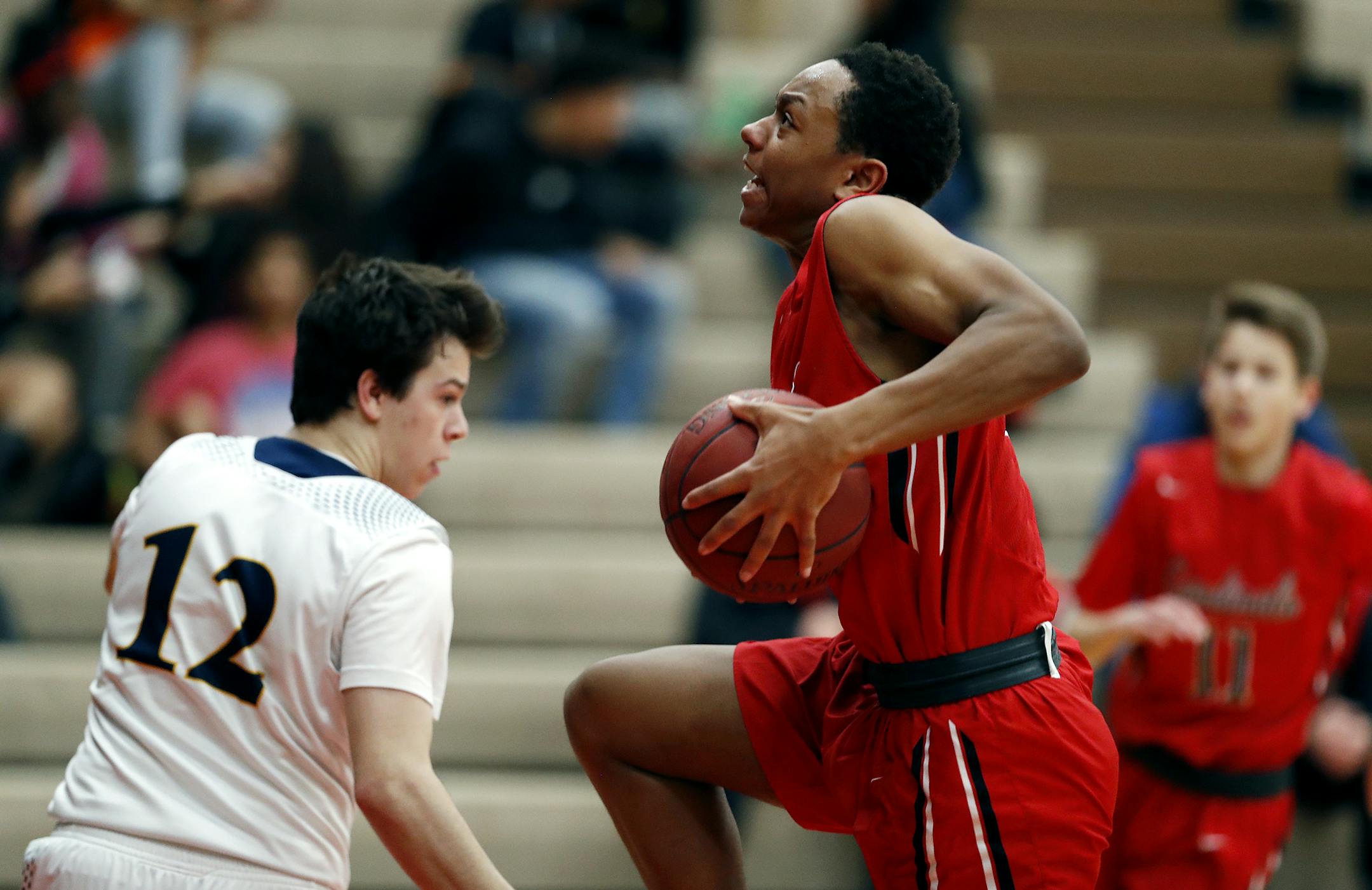 Lionel Warner drove to the basket on Totion-Grace guard Nick Flottmeier at Coon Rapids High school Tuesday January 24, 2017 in Coon Rapids, MN.] Coon Rapids played Totino-Grace in boys basketball . JERRY HOLT • jerry.holt@startribune.com