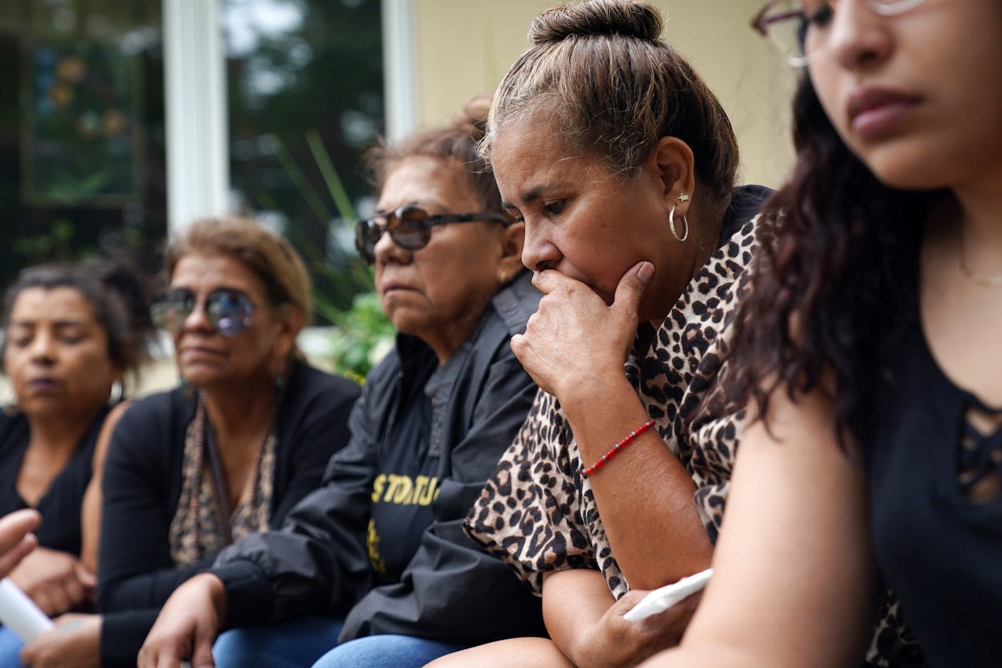 Elsa Villarreal, second from right, the mother of Ricardo Torres Jr. who was shot and killed by an Olivia police officer on July 4th in an alley, wept as she spoke about her son's death surrounded by family outside the Dirks-Blem Funeral Home Friday. ] ANTHONY SOUFFLE • anthony.souffle@startribune.com