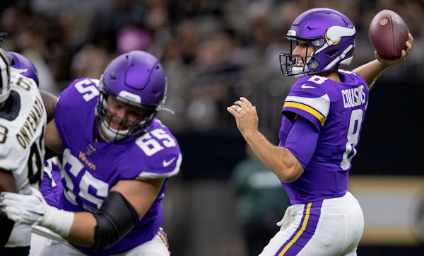 Vikings quarterback Kirk Cousins attempted a pass in the first quarter.