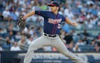 Minnesota Twins' Tommy Milone (33) winds up during the second inning of the team's baseball game against the New York Yankees on Friday, June 24, 2016
