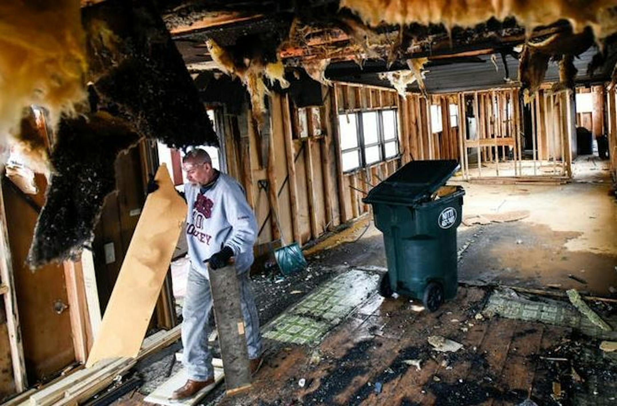 A worker stripped material from the Inver Grove Heights home of Tiffany Meyers, who died in a house fire in late February.