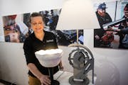 Dunwoody College of Technology's lab manager Erin Moren points out lamps that will be part of a student showcase at the upcoming Minneapolis Home and 