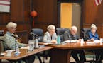 Winona County Commissioner Chris Meyer, second from left, asks a question during a meeting between city and county officials Monday, April 15, 2024, i