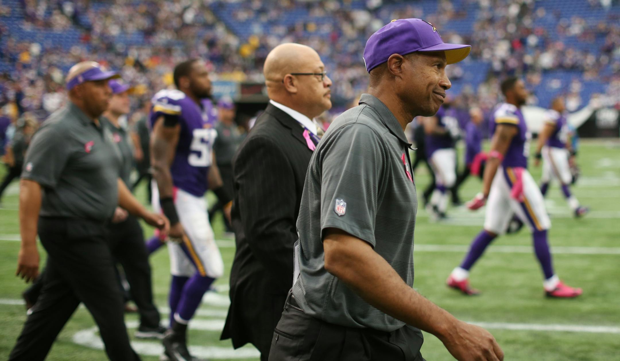 Vikings coach Leslie Frazier walked on the field after losing 35-10 to the Carolina Panthers.