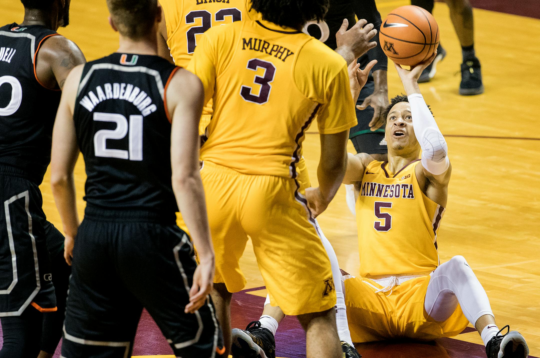 Amir Coffey attempted and made a shot sitting from the floor in the first half.