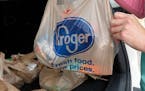 FILE - A customer removes her purchases at a Kroger grocery store in Flowood, Miss., Wednesday, June 26, 2019. The Federal Trade Commission on Monday,