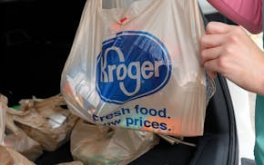 FILE - A customer removes her purchases at a Kroger grocery store in Flowood, Miss., Wednesday, June 26, 2019. The Federal Trade Commission on Monday,