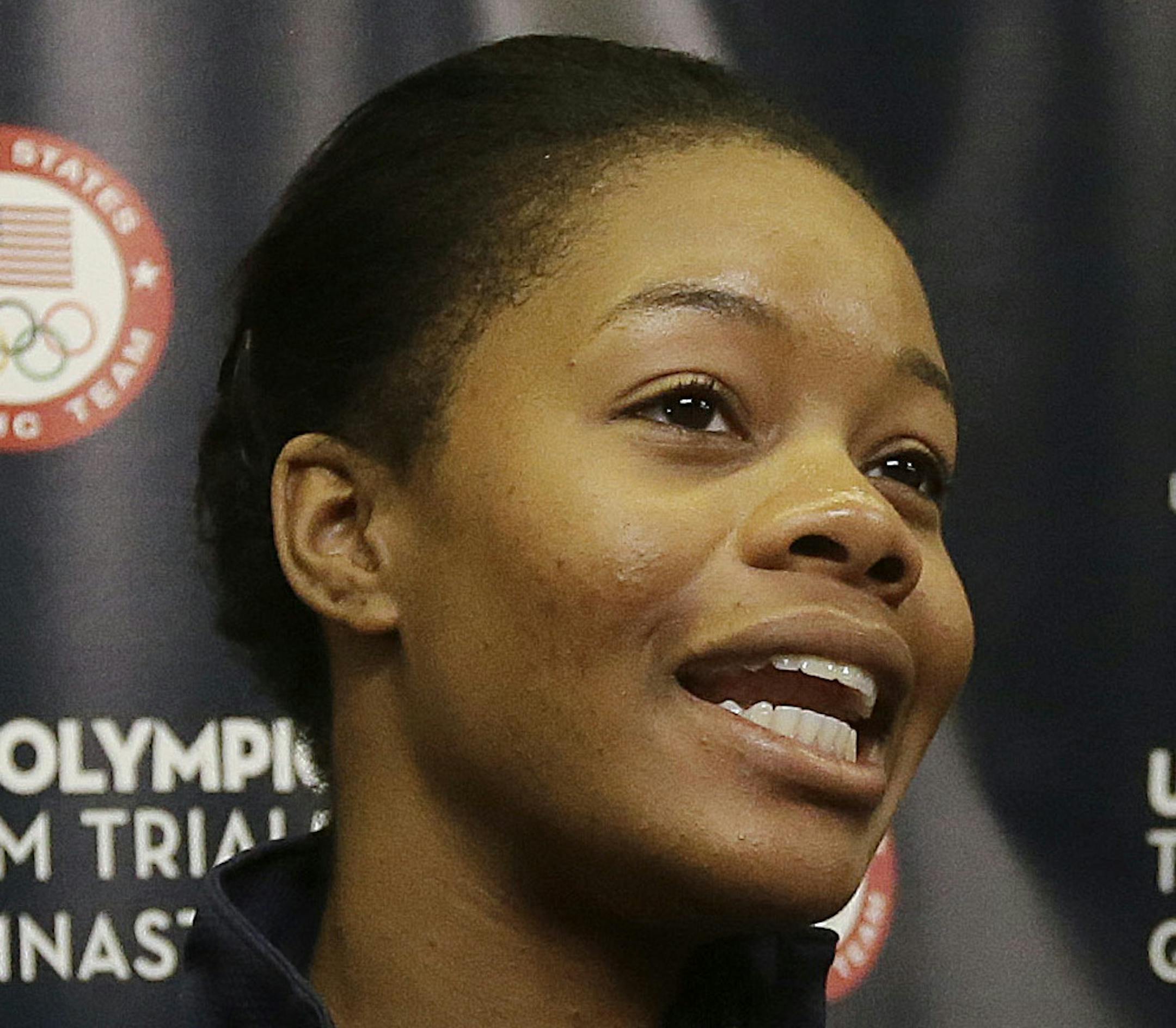 Gabrielle Douglas is interviewed after practice at the U.S. Olympic trials in gymnastics in San Jose, Calif., Thursday, July 7, 2016. (AP Photo/Jeff Chiu)