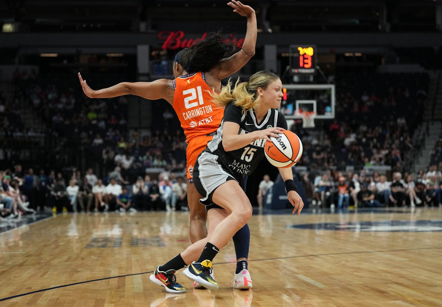 Minnesota Lynx guard Rachel Banham (15) sneaks around Connecticut Sun guard DiJonai Carrington (21) with the ball in the second quarter. The Minnesota Lynx hosted the Connecticut Sun at the Target Center on Friday, July 22, 2022 in Minneapolis, Minn. ] RENEE JONES SCHNEIDER • renee.jones@startribune.com