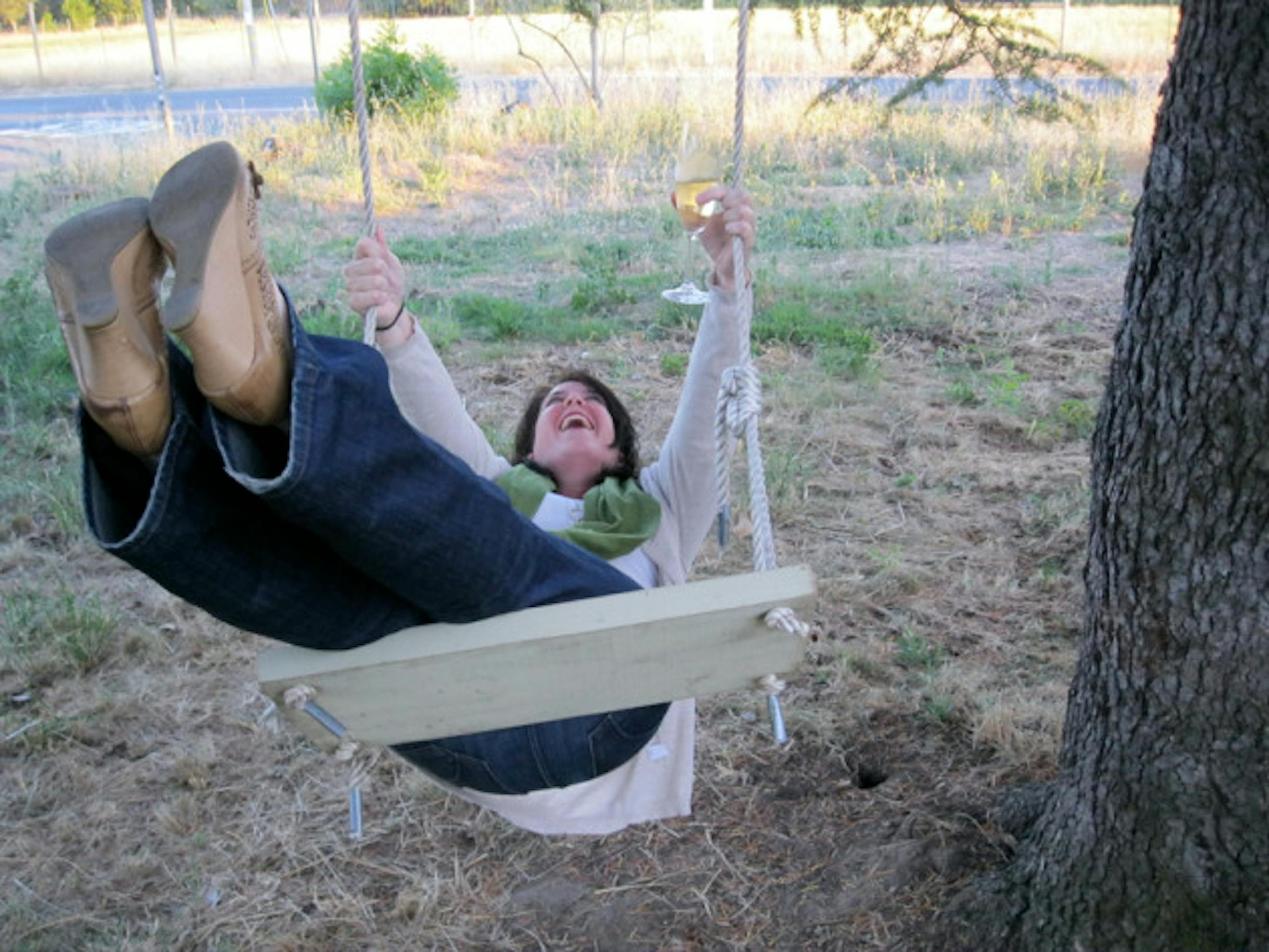 Wine colleague and friend, Sara. Note: when on a wine trip, wine can be enjoyed in many places—including on wooden swings.