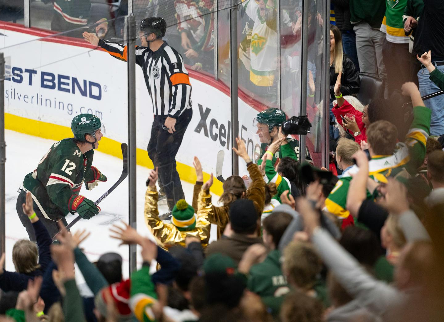Matt Boldy rushes to congratulate Kirill Kaprizov after Kaprizov scored his third goal of the game Sunday.