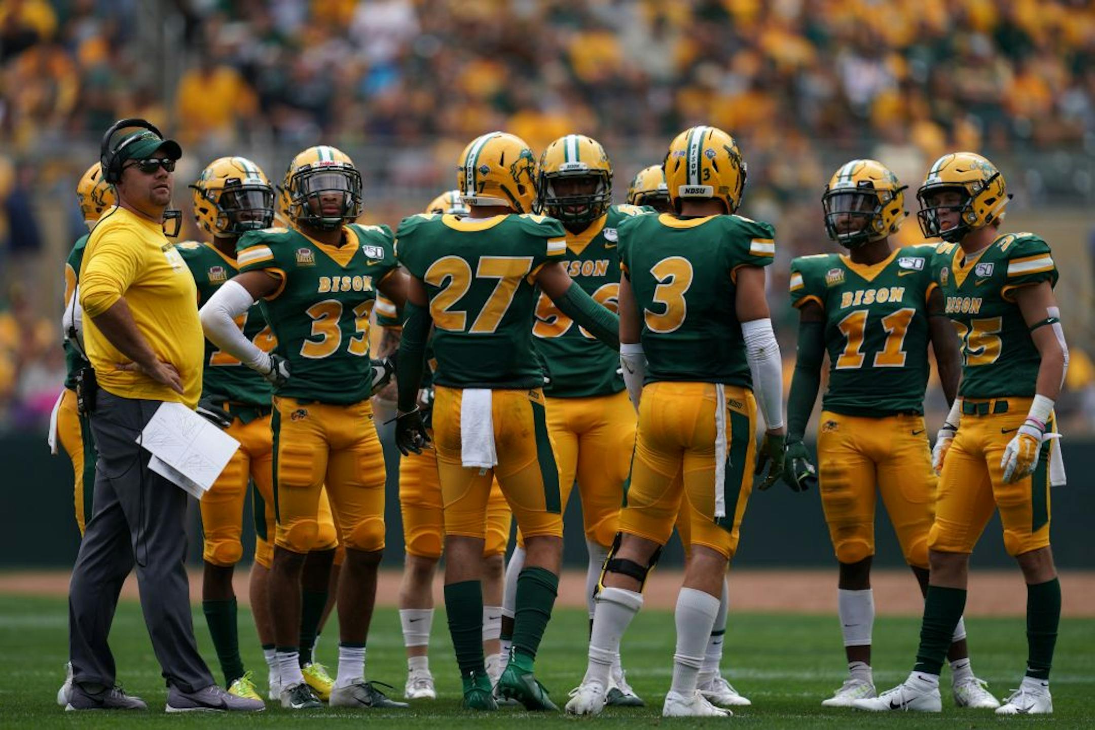 North Dakota State Bison players stood on the field during a timeout in the first half.