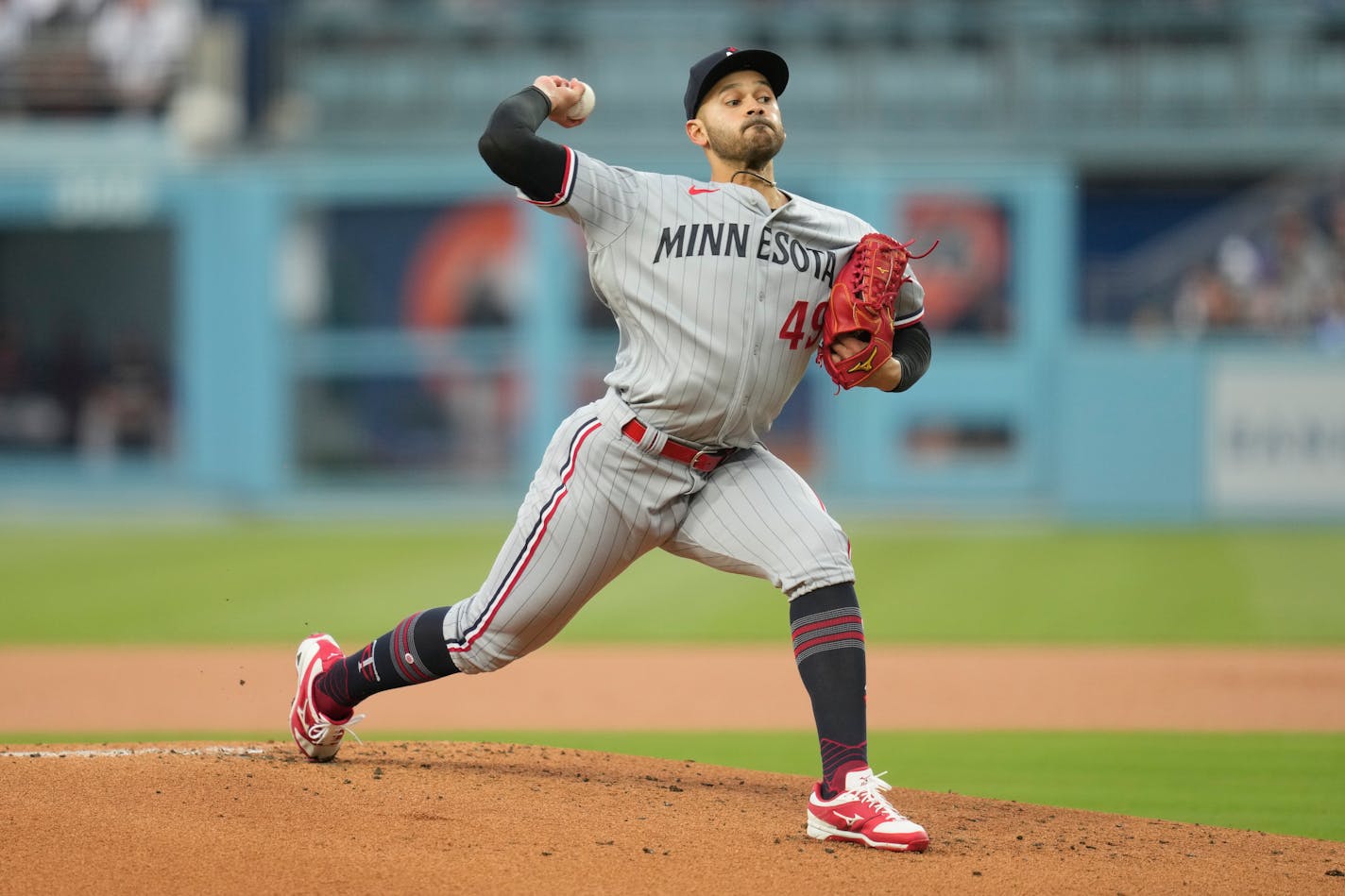 Minnesota Twins starting pitcher Pablo Lopez (49) throws during the first inning of a baseball game against the Los Angeles Dodgers in Los Angeles, Monday, May 15, 2023. (AP Photo/Ashley Landis)