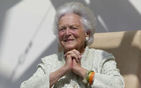 FILE - In a Thursday, Aug. 22, 2013, file photo, former first lady Barbara Bush listens to a patient's question during a visit to the Barbara Bush Chi
