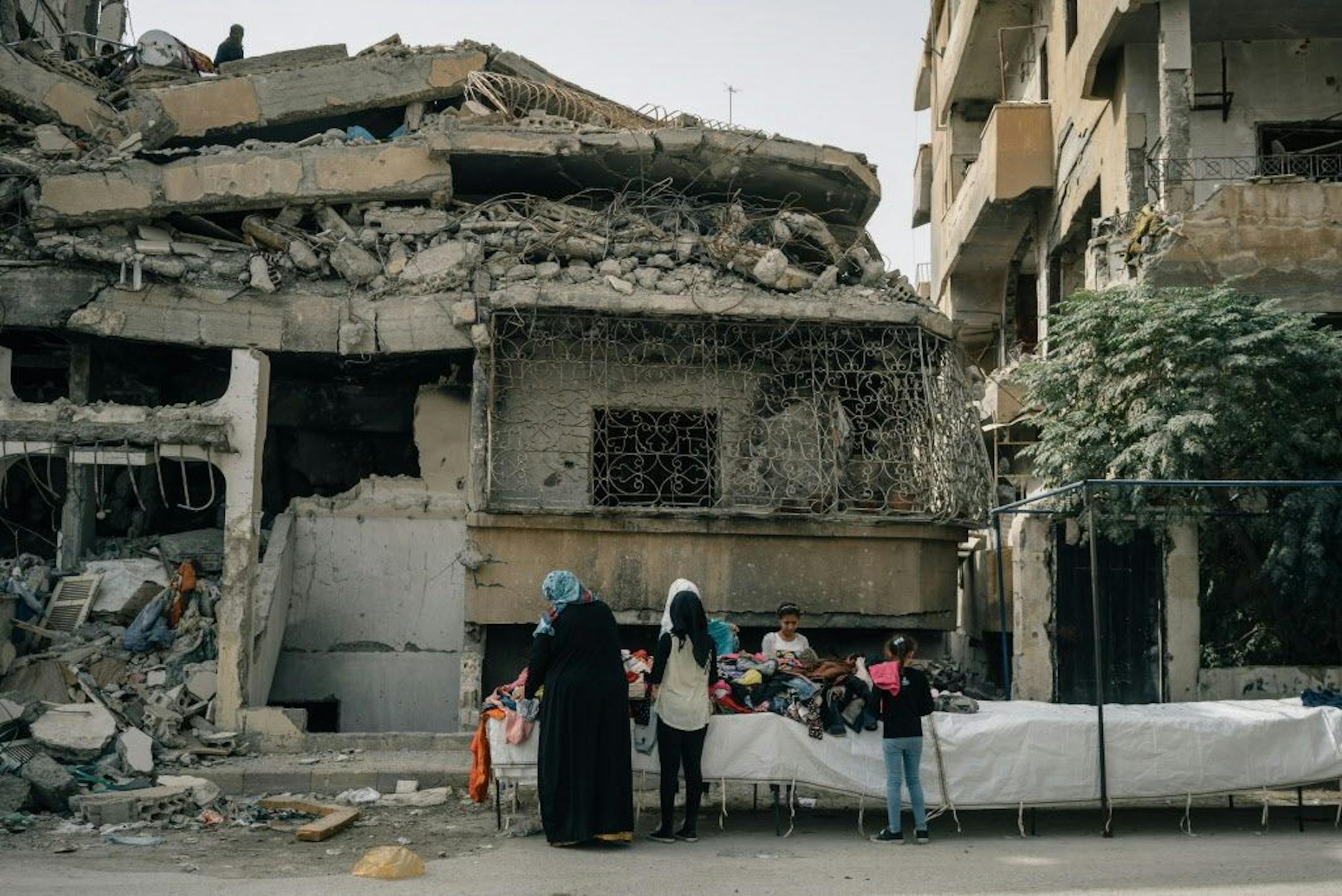 Used clothes are sold at a street stand in Raqqa, Syria, where signs of life have returned in some neighborhoods, on Oct. 14, 2018. MUST CREDIT: Photo for The Washington Post by Alice Martins