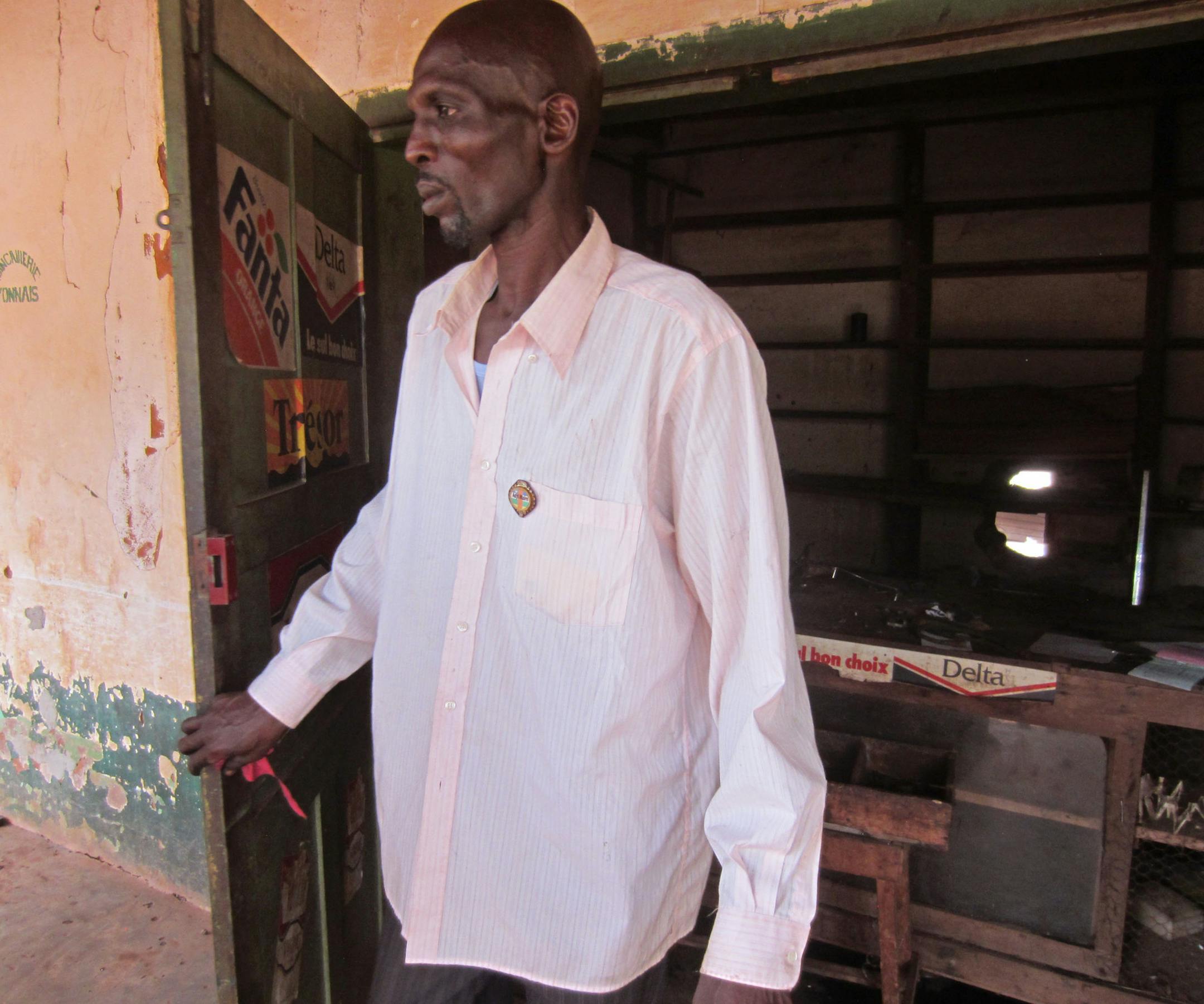 In this Monday, Feb. 10, 2014 photo released by Amnesty International, Deputy Mayor Saleh Dido exits a building in Mbaiki, Central African Republic. Even as thousands of Muslims fled the town, Saleh Dido vowed to carry on with his duties. On Friday, Feb. 28, 2014, witnesses said a mob armed with knives chased him and killed him. His fate shows how far the violence has gone in the Central African Republic, where hundreds of Muslims have been killed in just a few months, redefining who belongs her