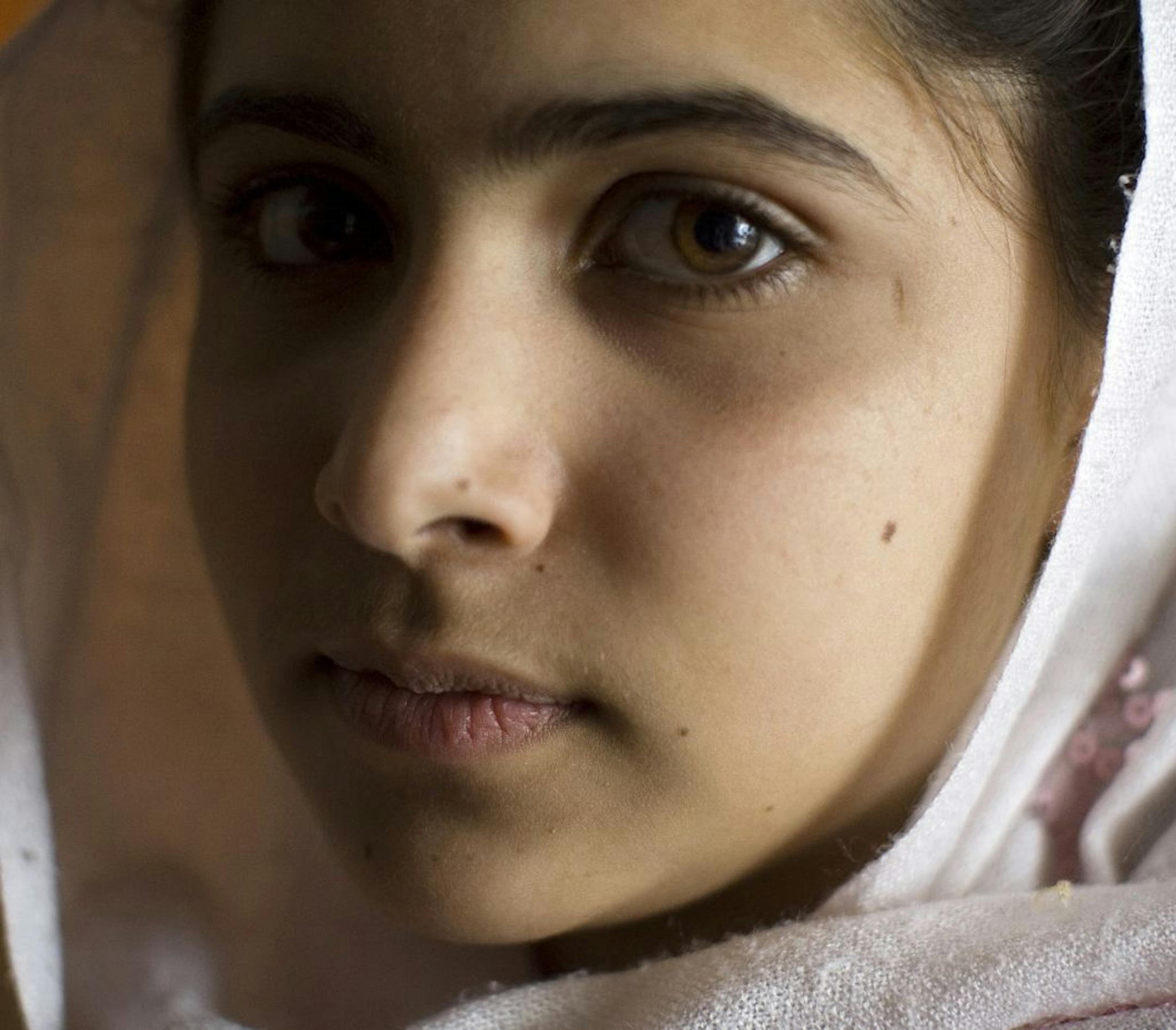 PESHAWAR, NORTH-WEST FRONTIER PROVINCE, PAKISTAN - MARCH 26, 2009: Malala Yousafzai, 12, lives in the Swat Valley with her family, pictured on March 26, 2009 in Peshawar, Pakistan. She wants to become a politician and is relieved that the schools have re-opened, but is scared that Taliban militants will forbid school for all girls after the 4th grade.