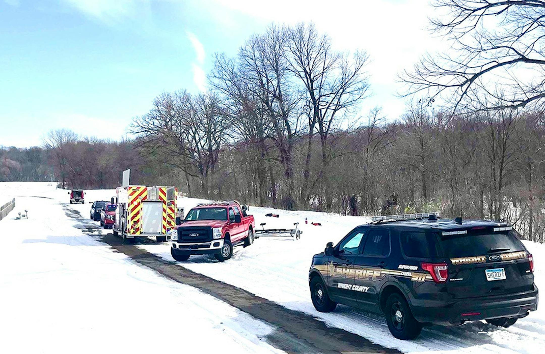 Emergency responders near the scene of a small-plane crash Saturday in the Crow Hassan Park Reserve..