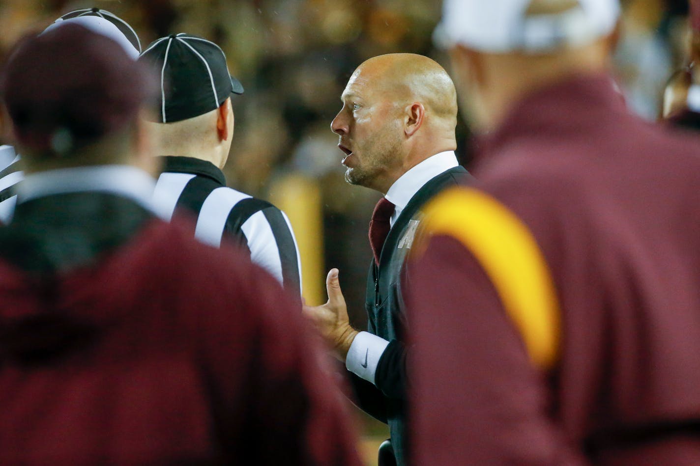 Minnesota coach P.J. Fleck pleads with officials on a review of a call that gave the ball to Ohio State after a Minnesota reception and fumble during the fourth quarter of an NCAA college football game Thursday, Sept. 2, 2021, in Minneapolis. Ohio State won 45-31. (AP Photo/Bruce Kluckhohn)