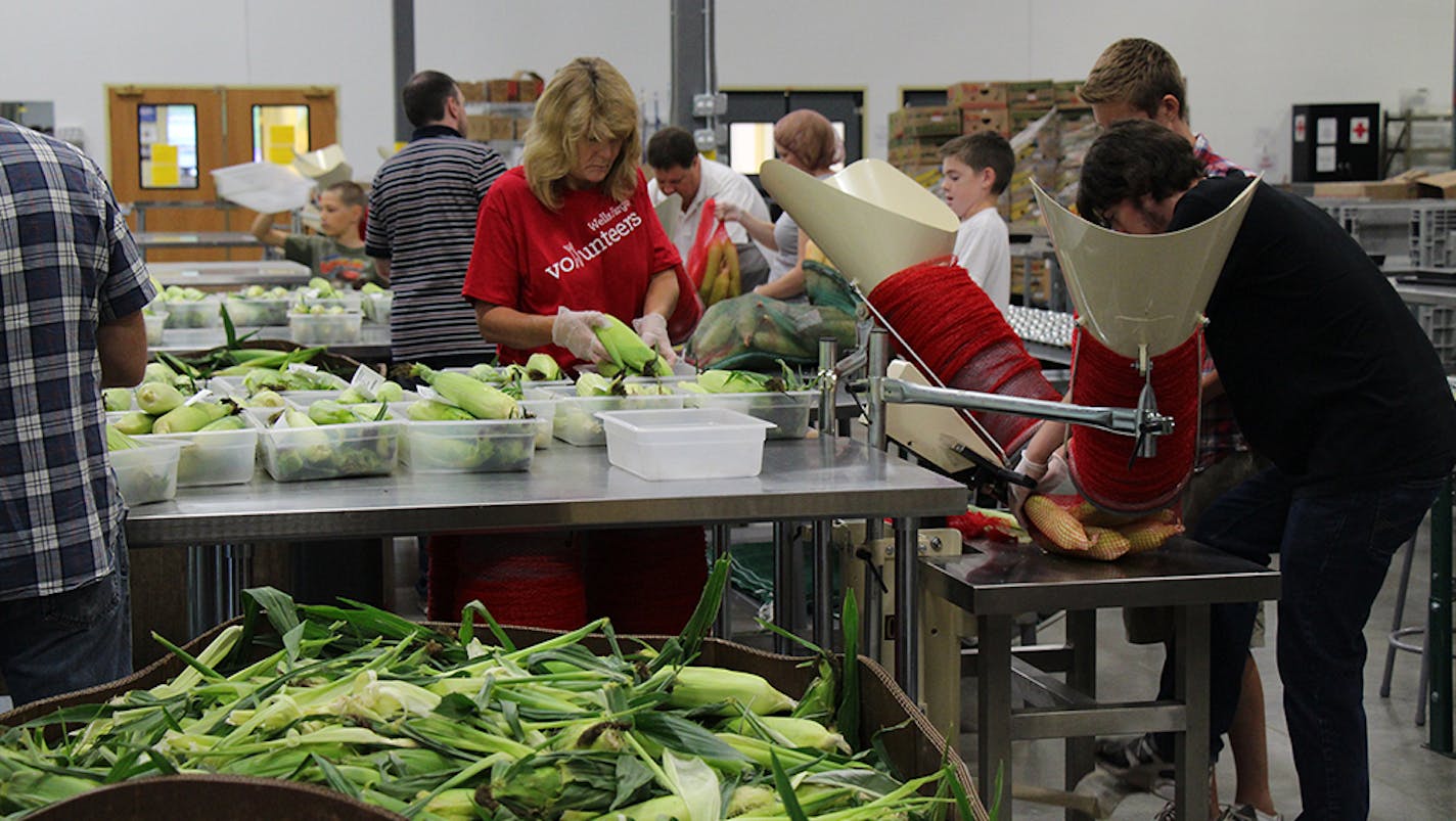 Volunteers pack corn at Second Harvest Heartland's Golden Valley facility in 2015. The nonprofit plans to move its headquarters to Brooklyn Park.