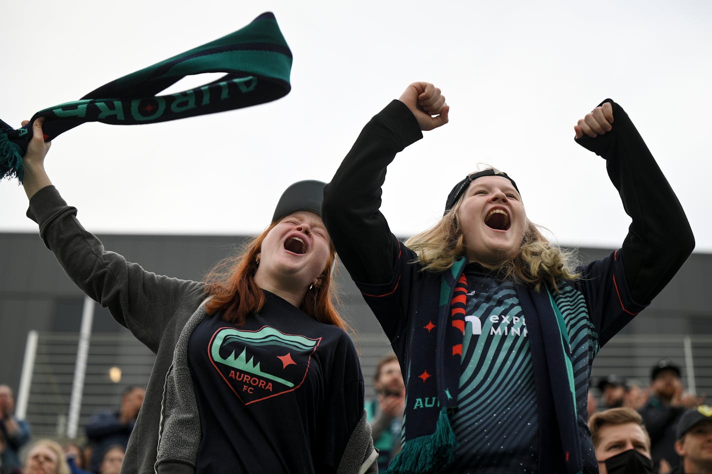 Aurora fans, including Nadia Hinman, left, and her sister Sam, cheered for their team before the inaugural match Thursday at TCO Stadium.