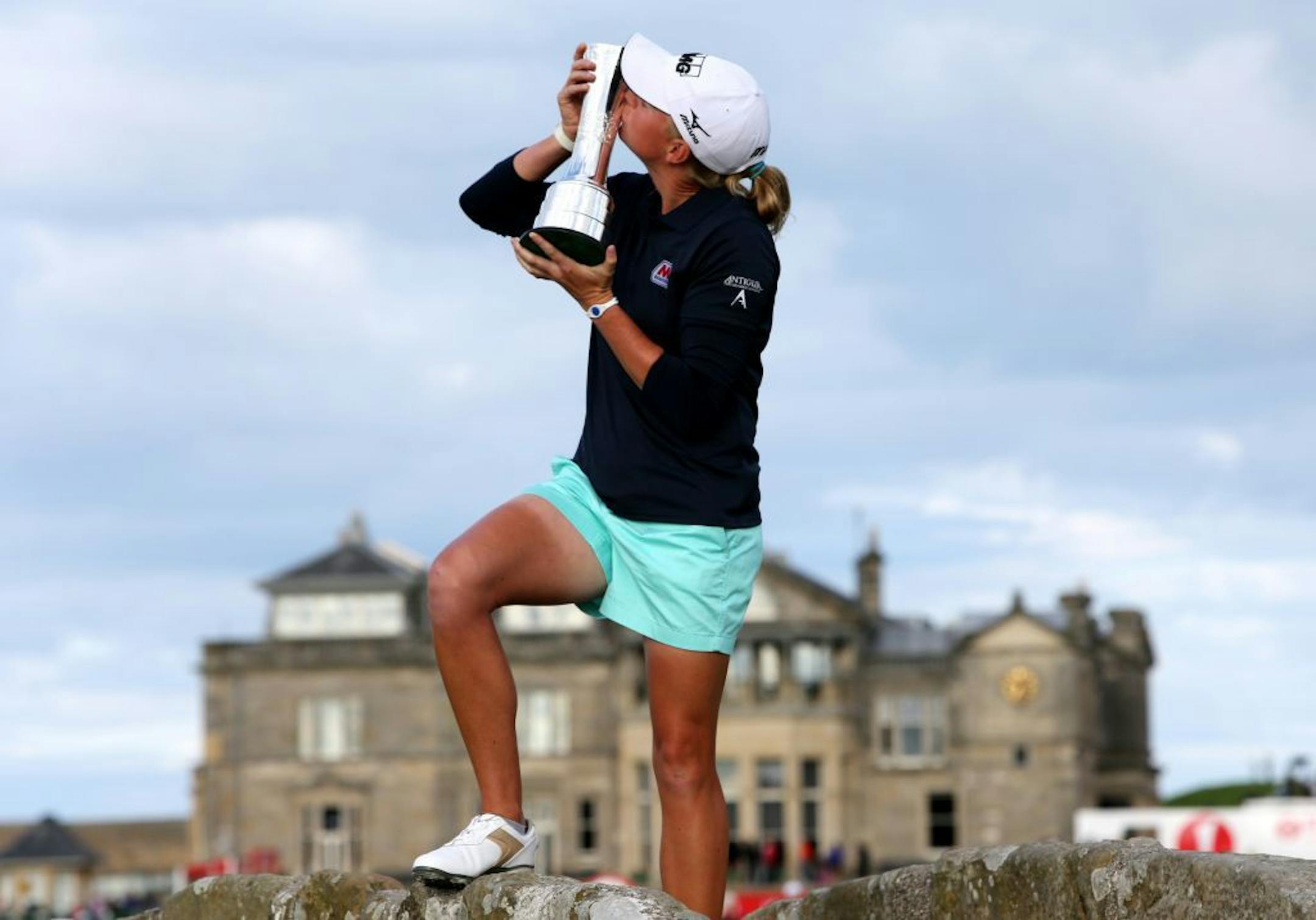 Stacy Lewis of the US poses with the trophy after winning Women's British Open golf championship on the Old Course at St Andrews, Scotland, Sunday Aug. 4, 2013.