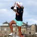 Stacy Lewis of the US poses with the trophy after winning Women's British Open golf championship on the Old Course at St Andrews, Scotland, Sunday Aug