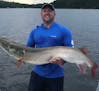 Corey Kitzmann of Davenport, Iowa, owns the new Minnesota muskie release record. He caught this 57 1/4 inch fish while on Lake Vermilion on Aug. 6, 20