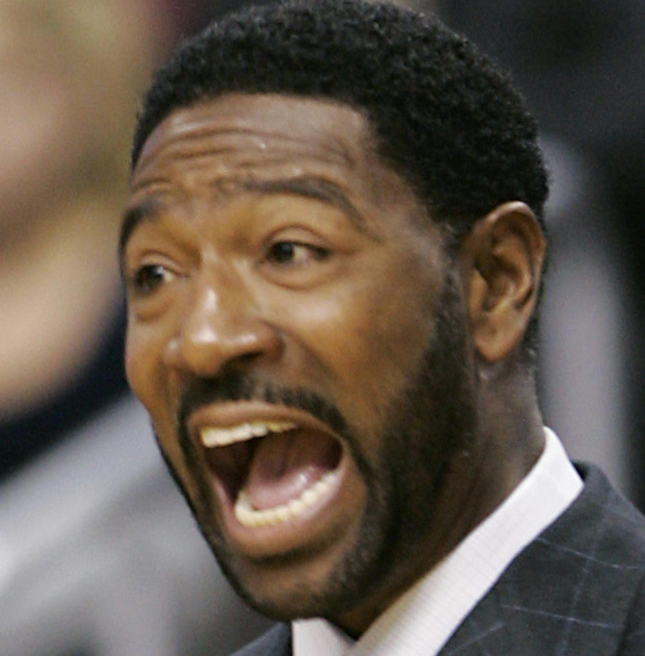 Toronto Raptors coach Sam Mitchell shouts directions to his team in the first half of an NBA basketball game against the Philadelphia 76ers, Wednesday, Oct. 29, 2008, in Philadelphia. The Raptors won team's season opener 95-84. (AP Photo/Tom Mihalek)