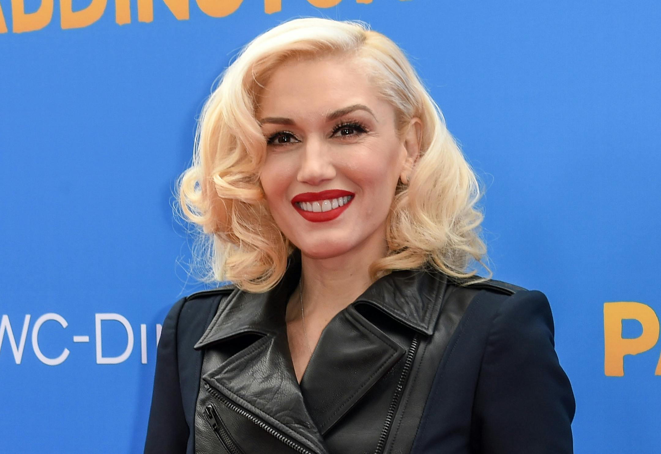 FILE - In this Jan. 10, 2015 file photo, Gwen Stefani arrives at the Los Angeles Premiere of "Paddington" in Los Angeles. Stefani is returning as coach of NBC's "The Voice" for its ninth season. The network announced Wednesday, June 10, that Stefani would be back on the job joining coaches Adam Levine, Blake Shelton and Pharrell Williams. (Photo by Rob Latour/Invision/AP, File)