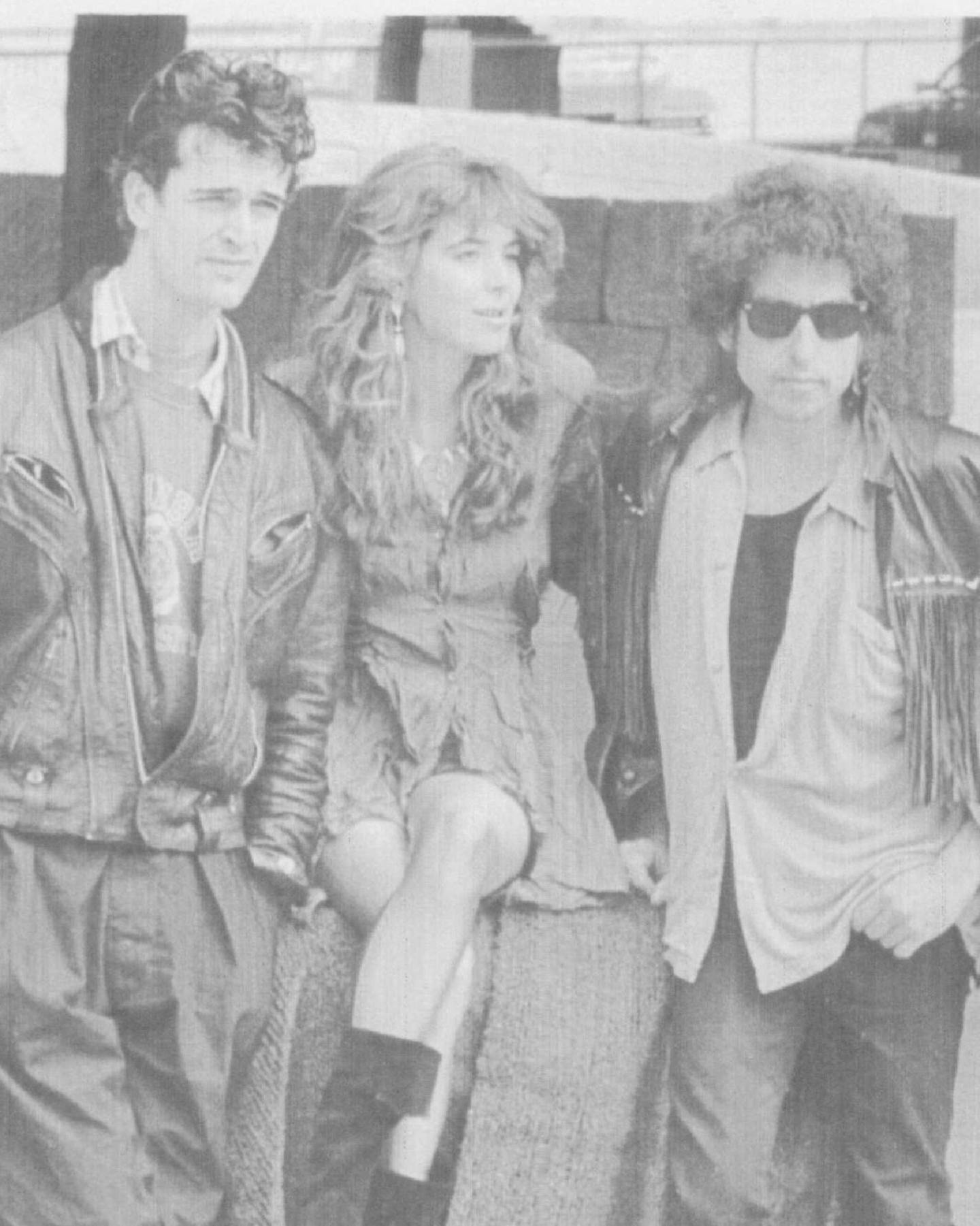 August 29,1986 Frizzy-haired rock legend Bob Dylan (R), seen recently during a break in filming, is here to star in his first movie in 10 years, and his biggest part yet. With the 45-year-old superstar are rock singer Fiona Flanagan, 24, of New Jersey, and British actor Rupert Everett, 26, both starring in the movie with him. In this big-budget film, "Hearts of Fire," Dylan will play an aging rock superstar. It will have 22 original songs and Dylan will write 4 of them. Arthur Herman, UPI