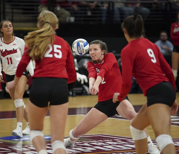Nebraska's Mikaela Foecke (2) with a dig in the first set against Illinois in the NCAA Women's Volleyball Championship Semifinal on Thursday, Dec. 13,