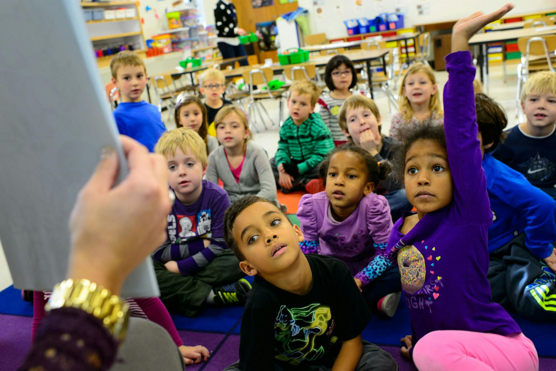 Drew Davis and Rubi Rock listened as Kindergarten teacher Kristin Koloski read The Mitten by Jan Brett to her all-day Kindergarten class at Meadowbrook Elementary in Golden Valley. Friday, November 15, 2013. ] GLEN STUBBE * gstubbe@startribune.com