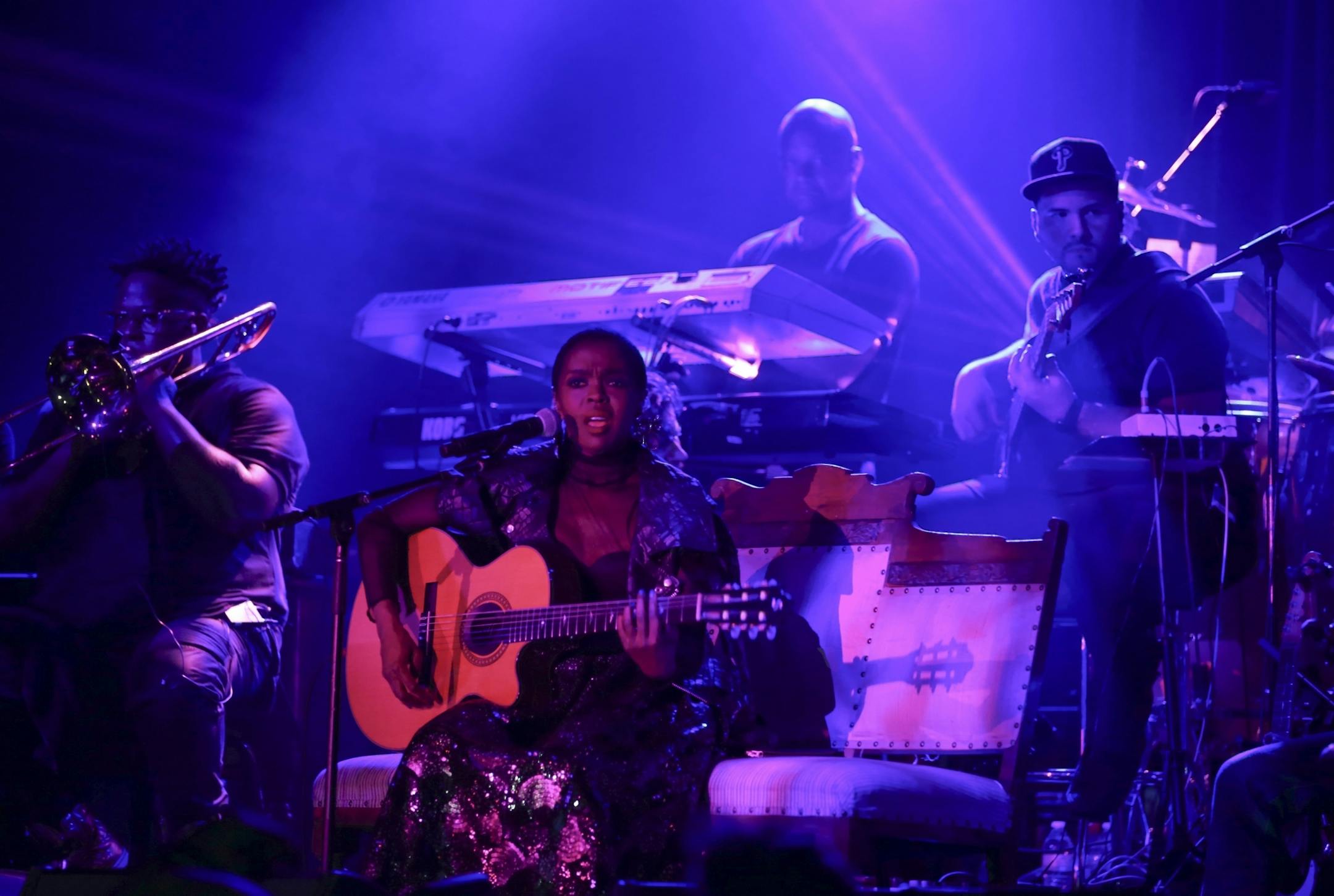 Lauryn Hill on the First Ave. stage with her band early in her set Sunday night.