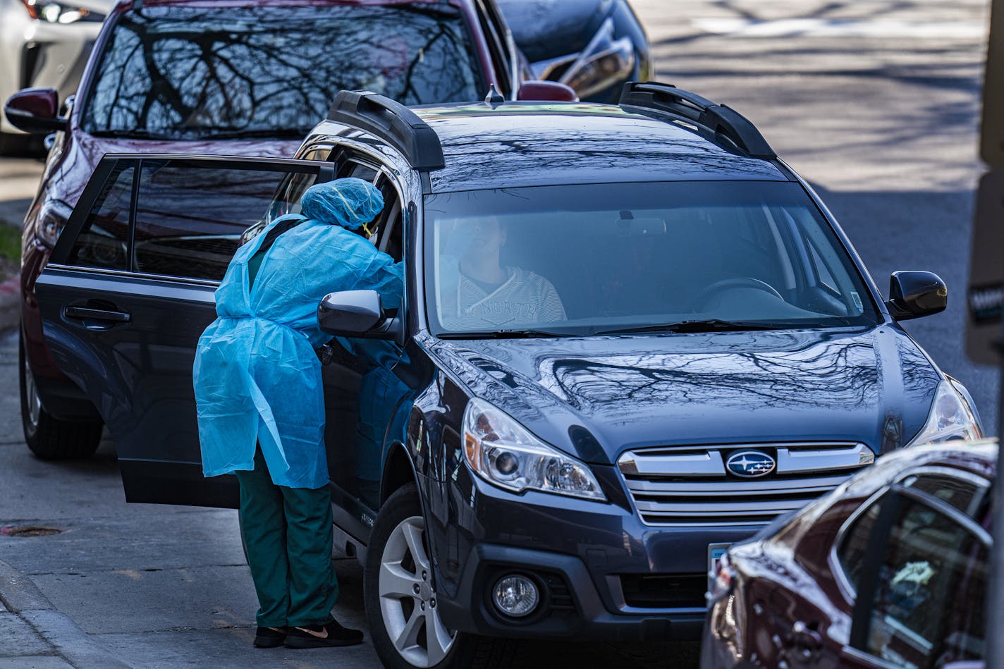 Patients lined up, with many waiting for over two hours, to get tested for COVID-19 at the People's Center Clinics & Services recently. [Credit: RICHARD TSONG-TAATARII, Star tribune]